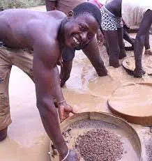 Miner panning gravel concentrate