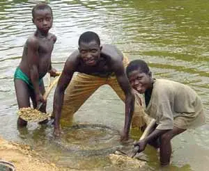 Panning river gravel for gold